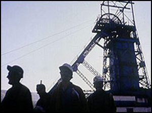 Coal Power build - miners stand in front of the pit head, ready to go to work deep underground.